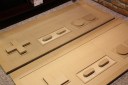 giant NES controllers with buttons cut out