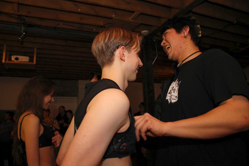 Audience members playing on Daniele and Kyle's PS1 controller bra/bro