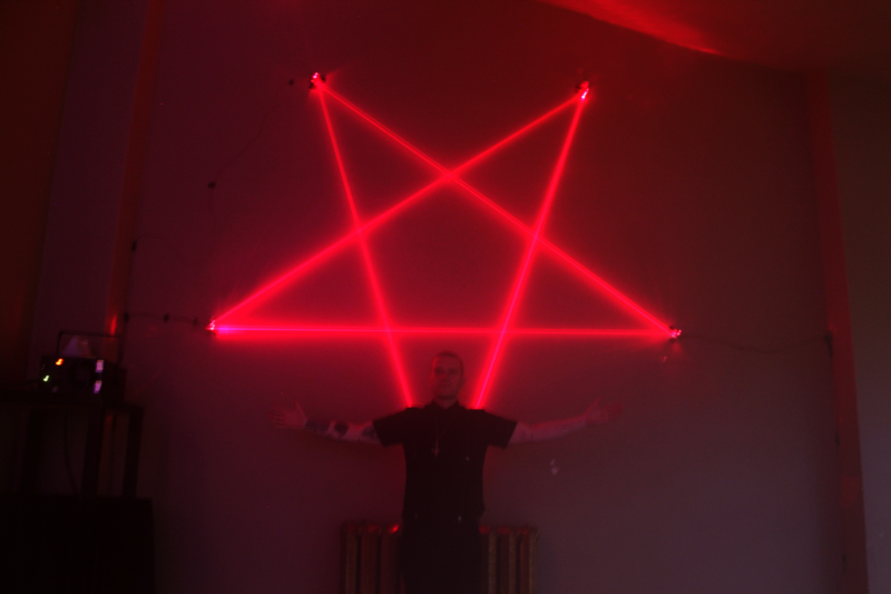posing in front of pentagram